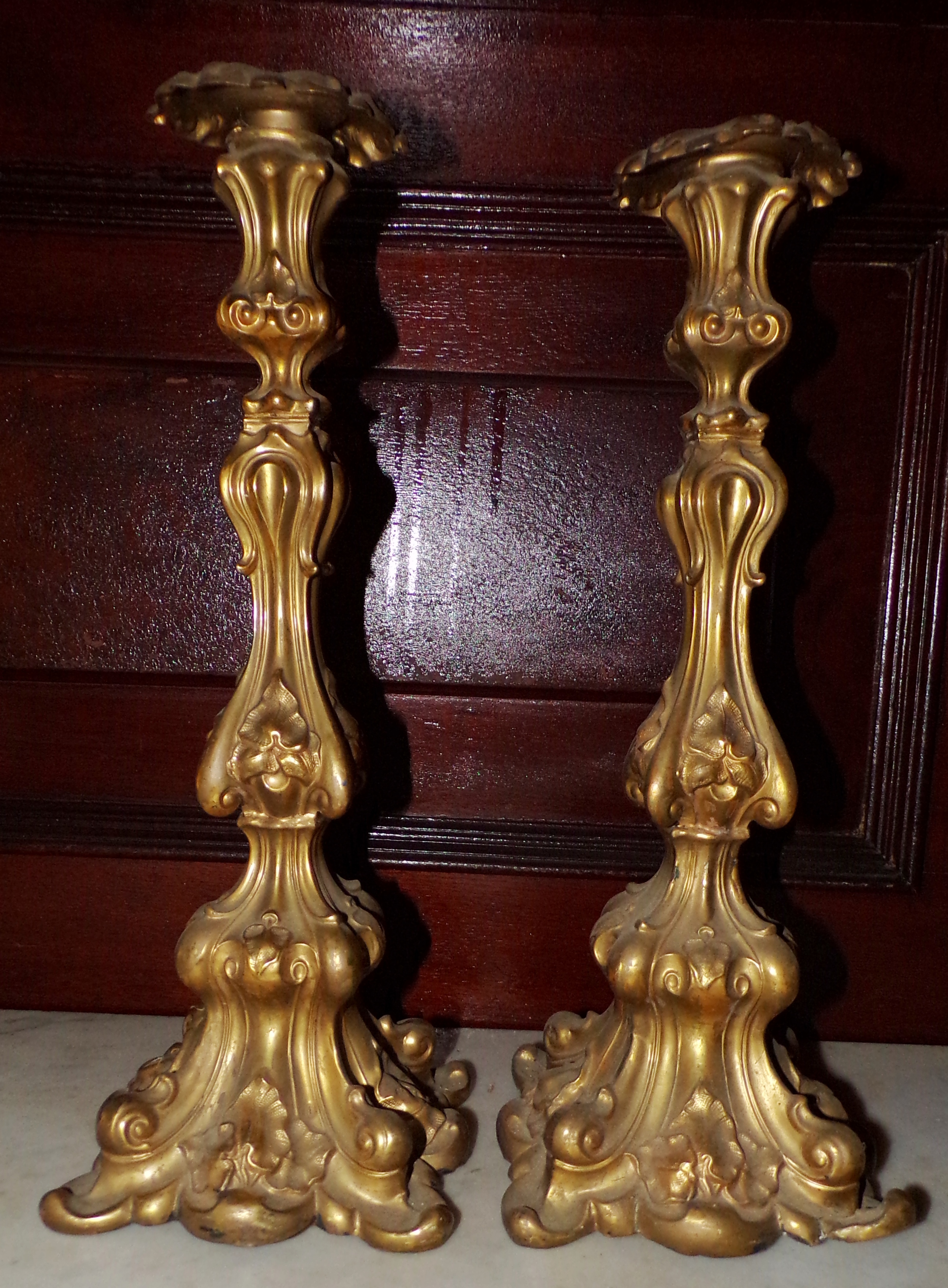 Appraisal: Pair of brass candlesticks plaster filled ''h