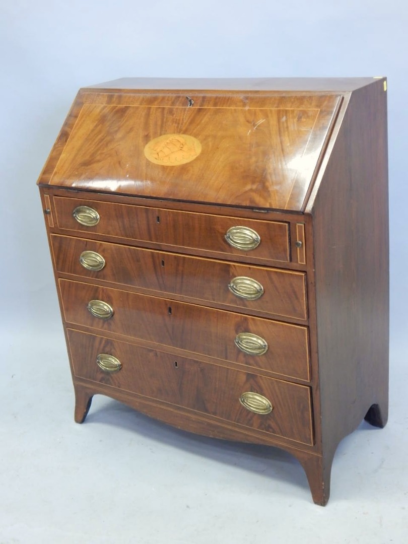 Appraisal: A George III mahogany bureau the fall inlaid with a