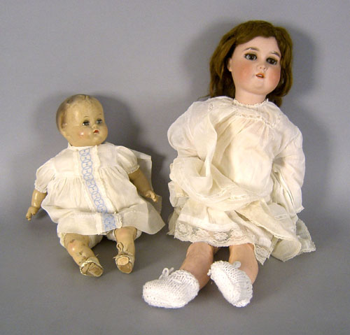 Appraisal: German porcelain head doll together with a composition doll