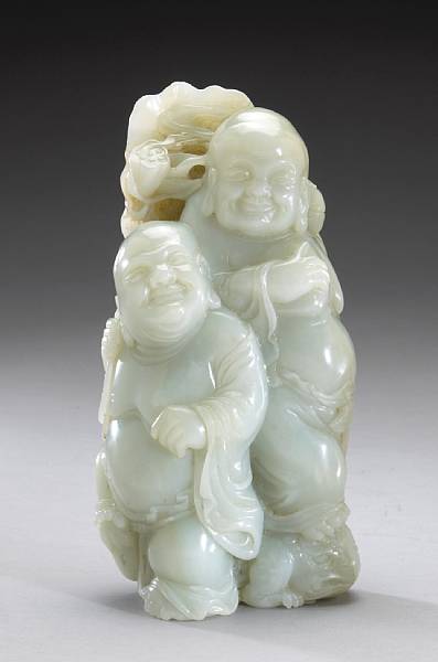 Appraisal: A pale gray-green jade sculpture of the Hehe twins One