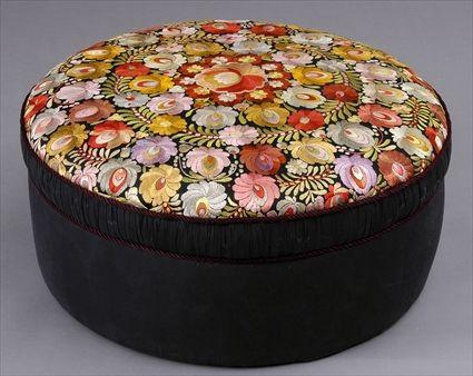 Appraisal: CHINESE SILK-EMBROIDERED OTTOMAN The circular seat worked with colorful flowers