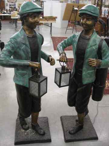 Appraisal: Pair of Life Size Bronze Statues of Golfcaddy with bag