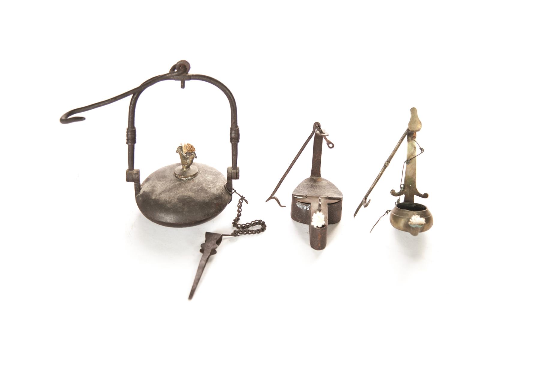 Appraisal: THREE AMERICAN LAMPS Nineteenth century Wrought iron miner's lamp with