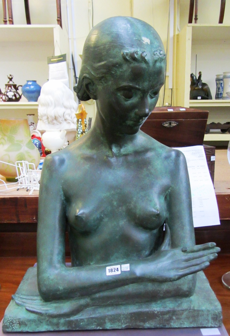 Appraisal: A patinated bronze bust th century modelled as a female