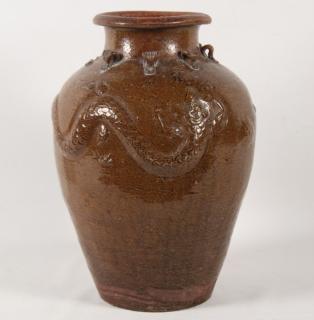 Appraisal: BROWN GLAZED TERRACOTTA WATER JAR WITH RAISED SERPENTS DRAGONS IN