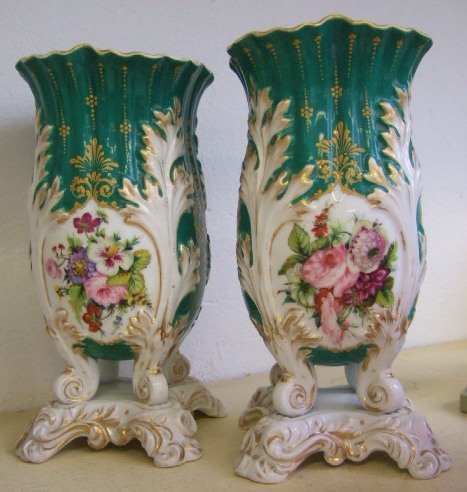 Appraisal: A pair of Coalport leaf moulded baluster vases cm high