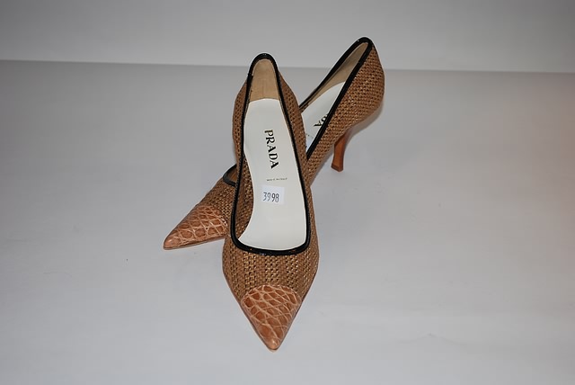 Appraisal: Prada beige straw pumps with leather toe Size B Good