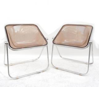 Appraisal: Giancarlo Piretti Manufactured by Castelli tinted plastic and aluminum chairs