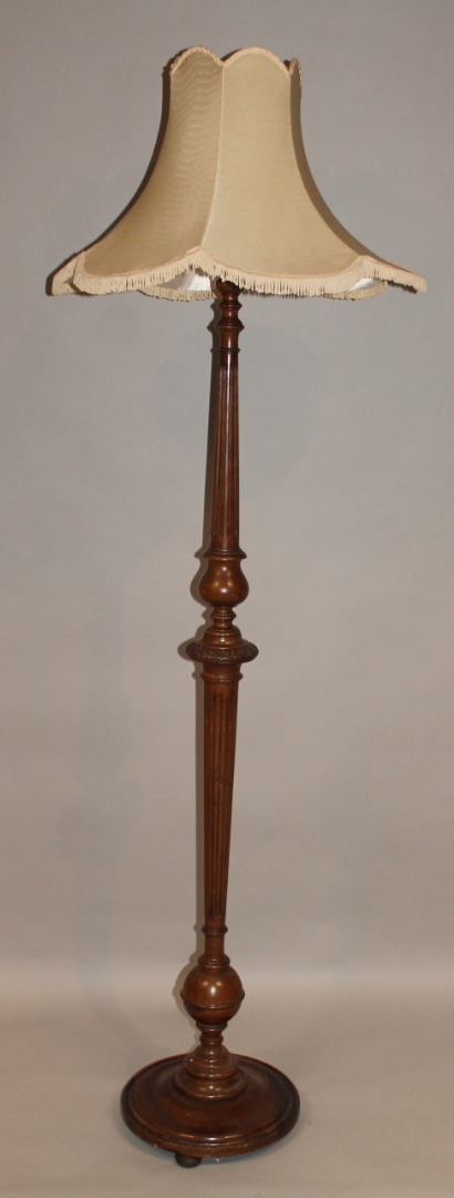 Appraisal: A thC mahogany stained standard lamp with later shade raised