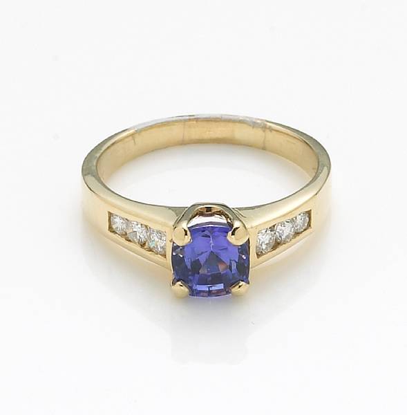 Appraisal: A tanzanite diamond and k gold ring centering a cushion-cut