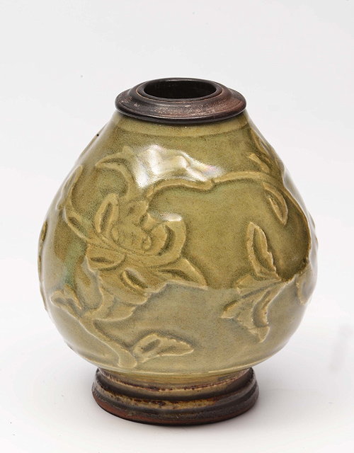 Appraisal: A CHINESE CELADON OVOID SMALL VASE with raised foliate designs