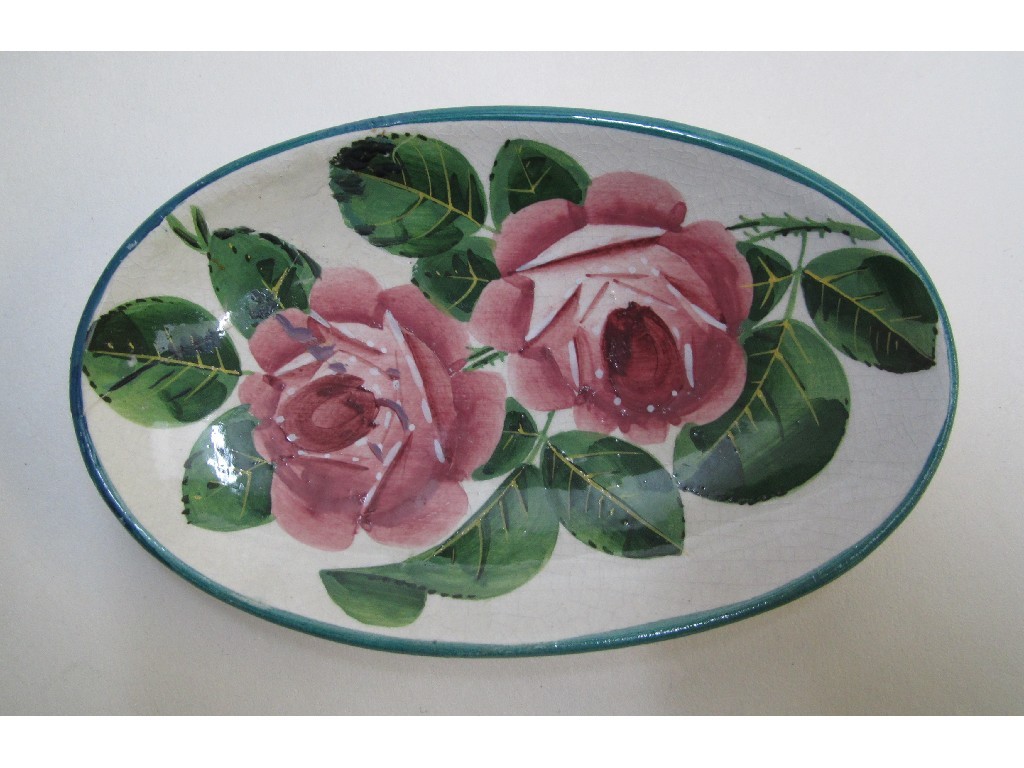 Appraisal: A Wemyss oval pin dish painted with cabbage roses impressed