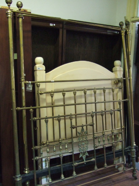 Appraisal: A Victorian turned brass four poster bed with white lace