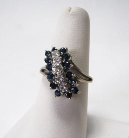 Appraisal: Possibly unstamped white gold lady's diamond and sapphire cocktail ring