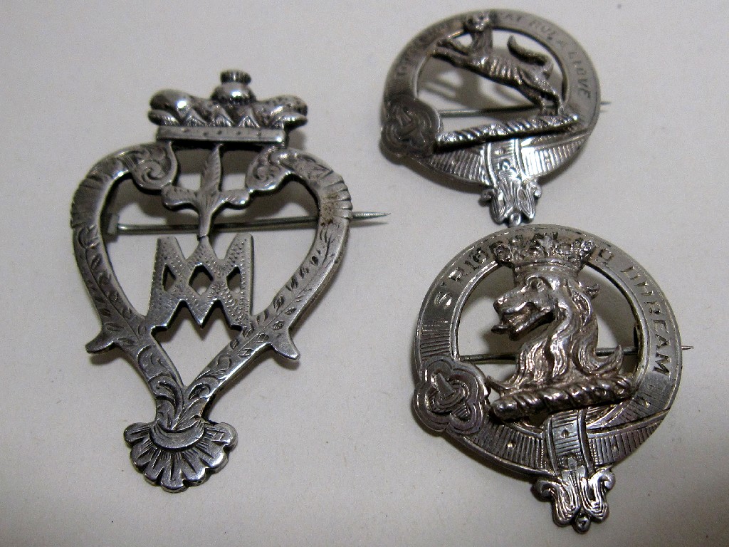 Appraisal: Two clan badges and a Luckenbooth brooch