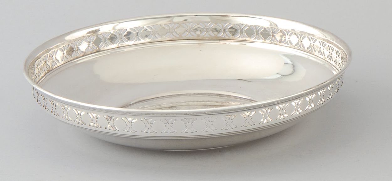 Appraisal: TIFFANY STERLING SILVER BOWL With pierced border Monogrammed Date mark