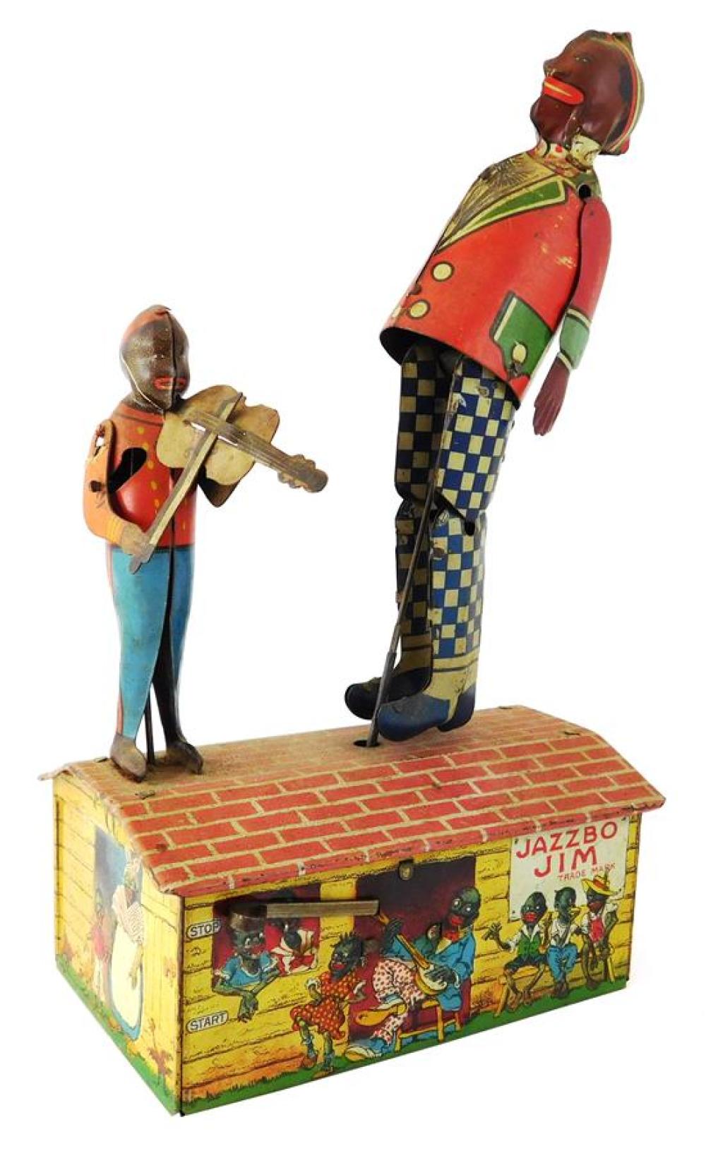 Appraisal: BLACK AMERICANA Tin Jazzbo-Jim with fiddling boy wind-up toy c