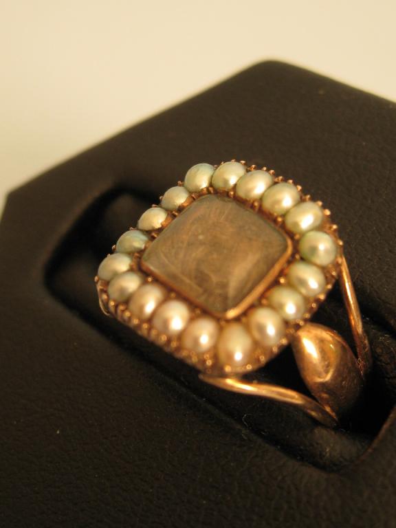 Appraisal: A Georgian Mourning Ring with lock of plaited hair in