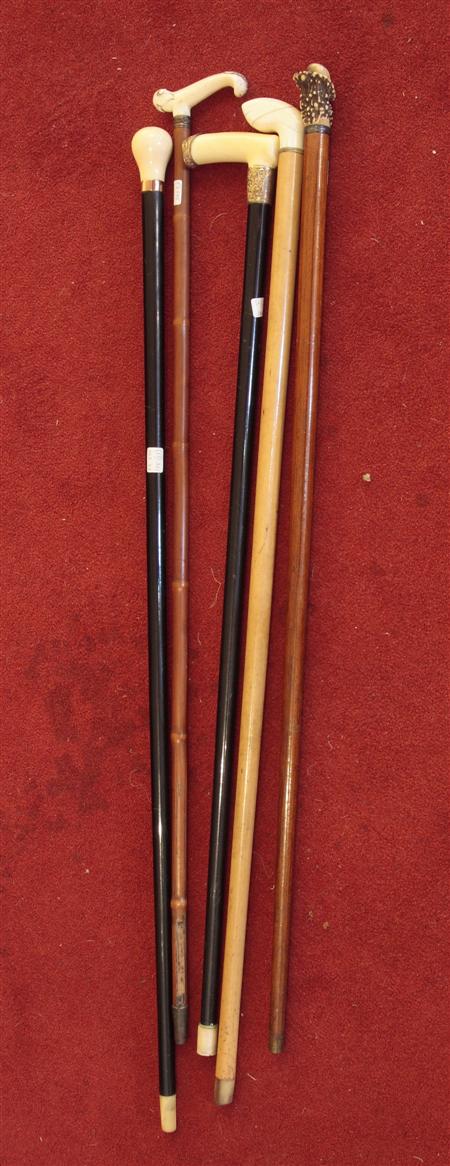 Appraisal: A collection of five ivory handled walking canes