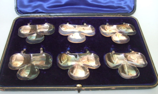 Appraisal: A set of six silver trefoil shaped dishes with clip