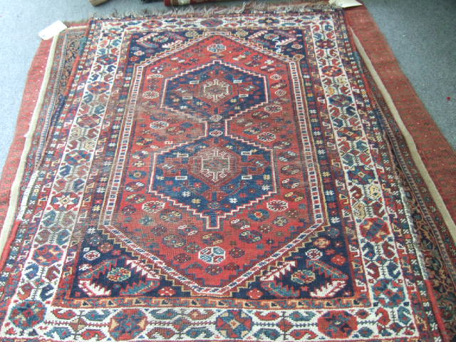 Appraisal: A Shiraz rug Persian the madder field with two indigo