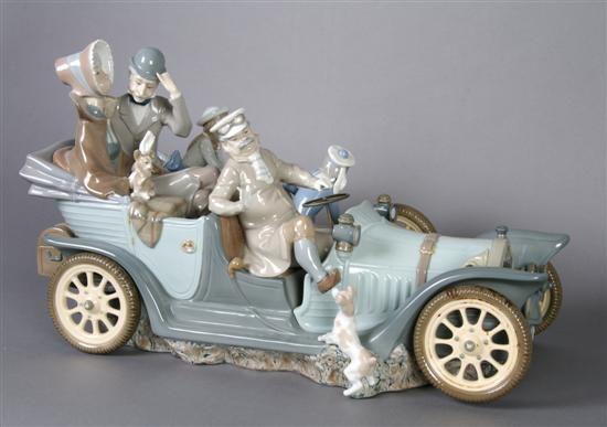 Appraisal: A Lladro Figural Group Antique Car Length inches