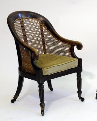 Appraisal: A SIMULATED ROSEWOOD BERGERE of tub form with arched hooped