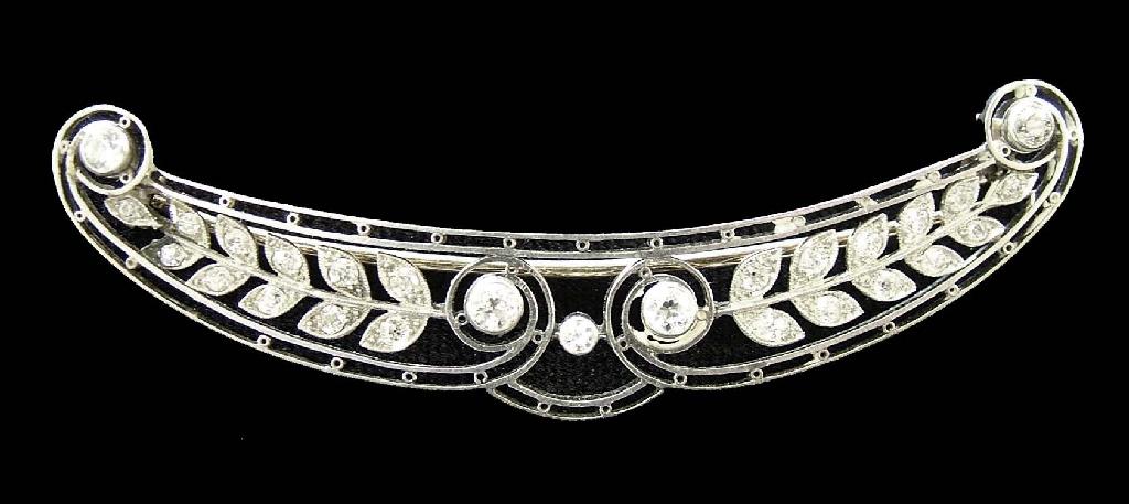 Appraisal: Attractive white gold foliate diamond set brooch with yellow metal