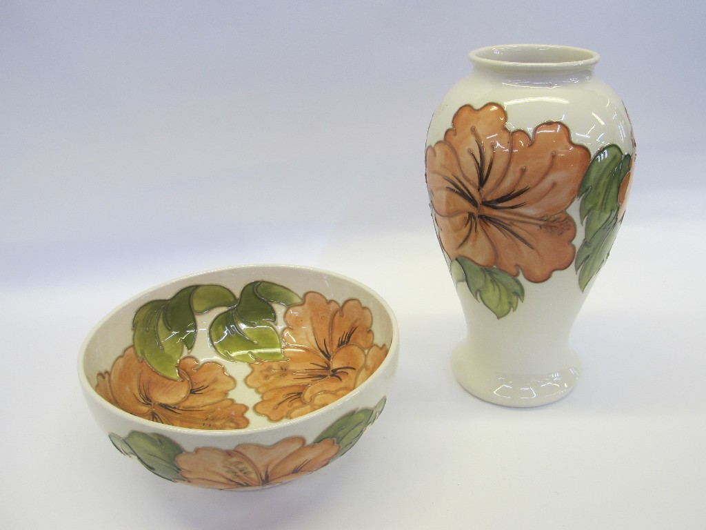 Appraisal: Moorcroft hibiscus pattern baluster vase and bowl on ivory ground