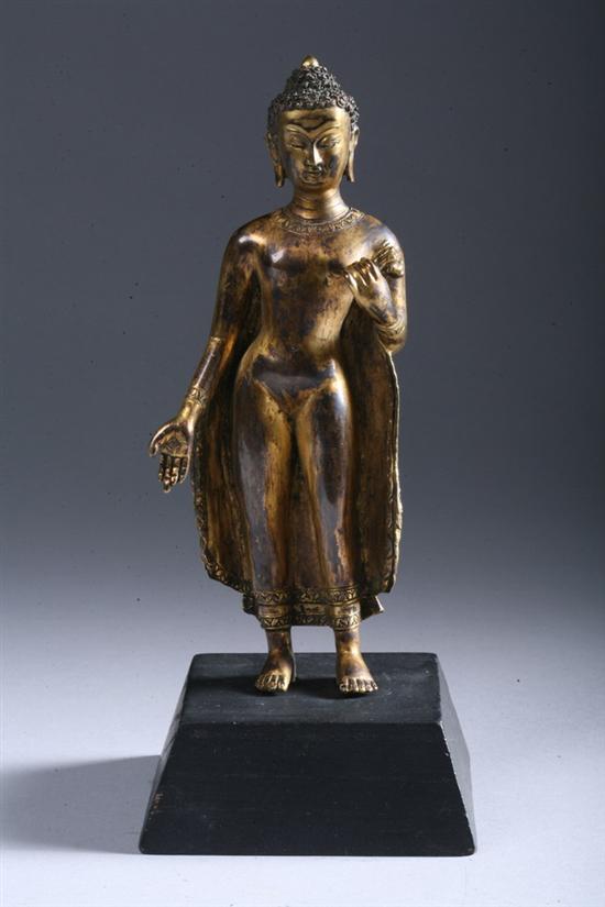 Appraisal: CHINESE GILT BRONZE FIGURE OF BUDDHA Standing holding a lotus