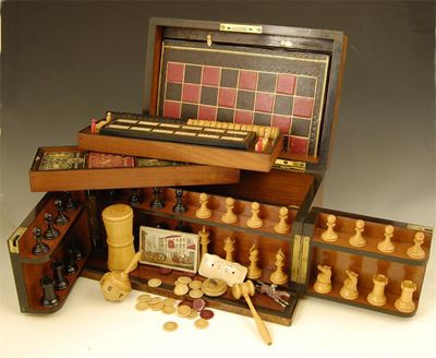 Appraisal: A Victorian walnut games compendium with macassar ebony mouldings the