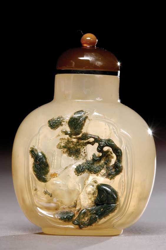 Appraisal: CAMEO AGATE SNUFF BOTTLE Finely hollowed carved translucent cameo agate