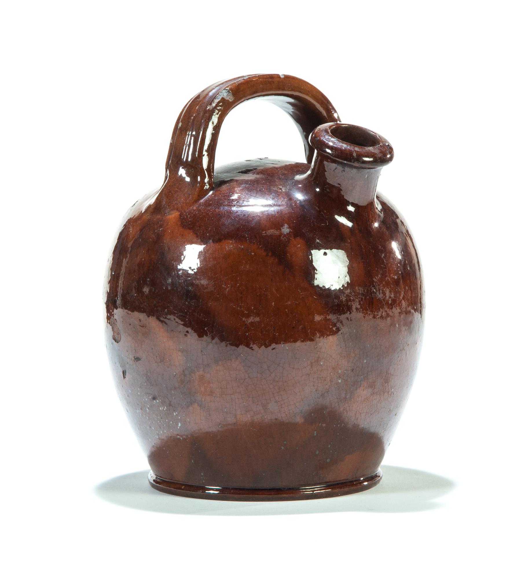 Appraisal: AMERICAN REDWARE HARVEST JUG Mid th century Small ovoid jug