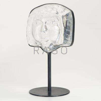 Appraisal: ERIK HOGLUND KOSTA BODA Glass face sculpture in enameled iron