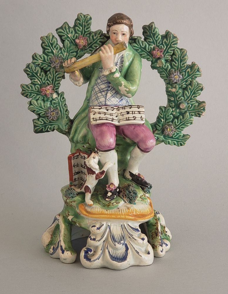 Appraisal: th Century Staffordshire Flute Player Figurine th Century Staffordshire Flute