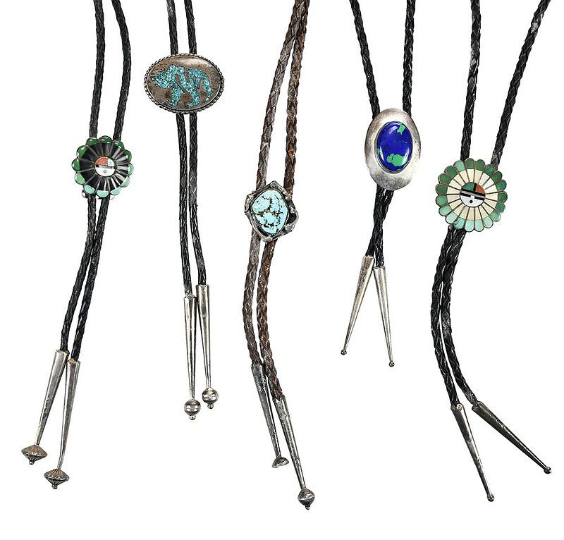 Appraisal: Five Gemstone Bolo Ties with two sun face designs stones