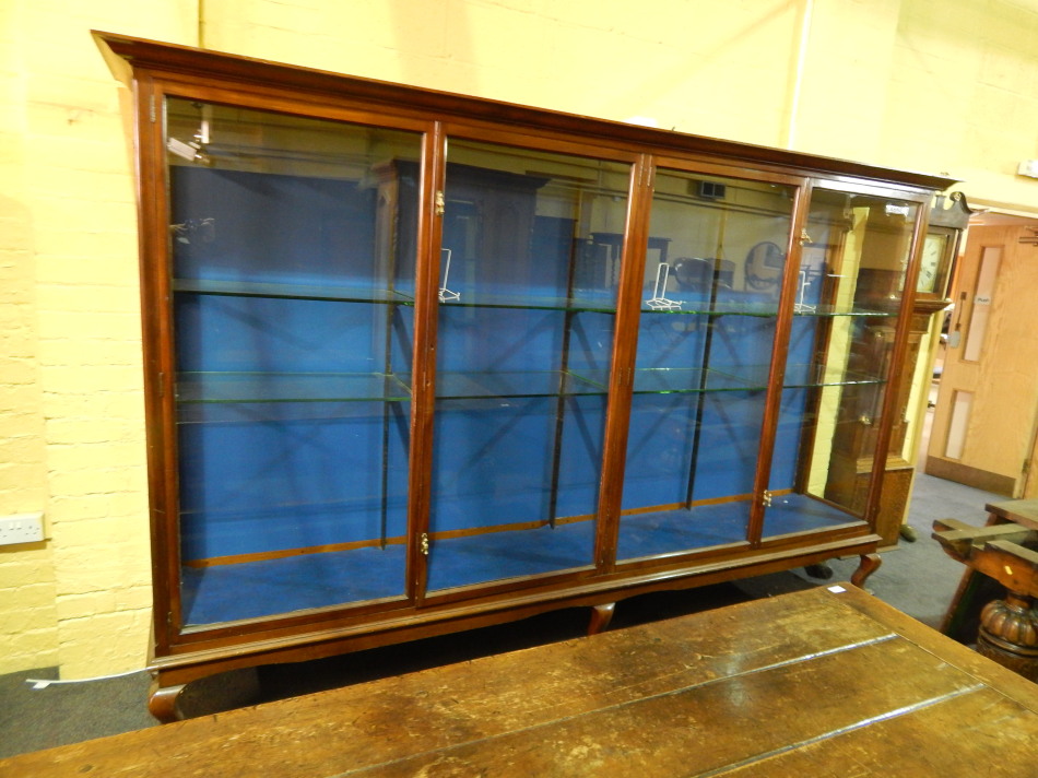 Appraisal: A large early thC mahogany shop display cabinet with a