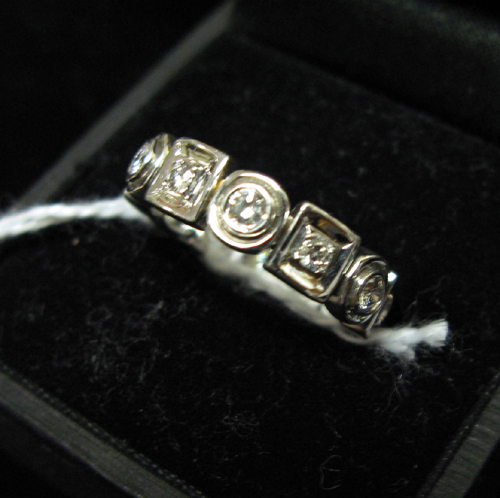 Appraisal: DIAMOND AND EIGHTEEN KARAT WHITE GOLD ETERNITY BAND the band