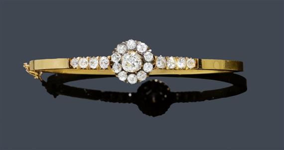 Appraisal: A DIAMOND BANGLE circa Yellow gold Distinctive unostentatious bangle with