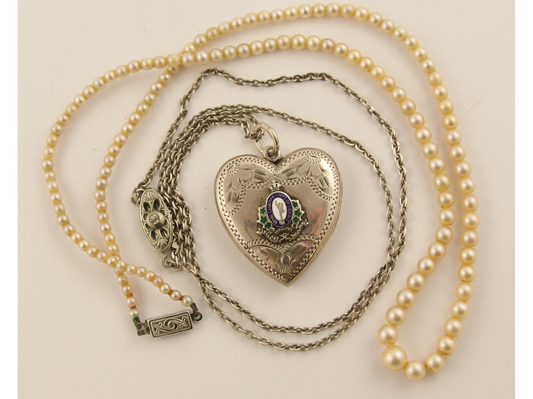 Appraisal: A silver heart shaped sweetheart locket for Royal Canadian Corps