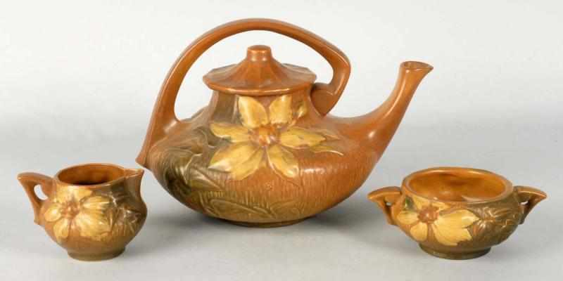 Appraisal: Roseville -Piece Brown Clematis Teapot Set Description Brown and light