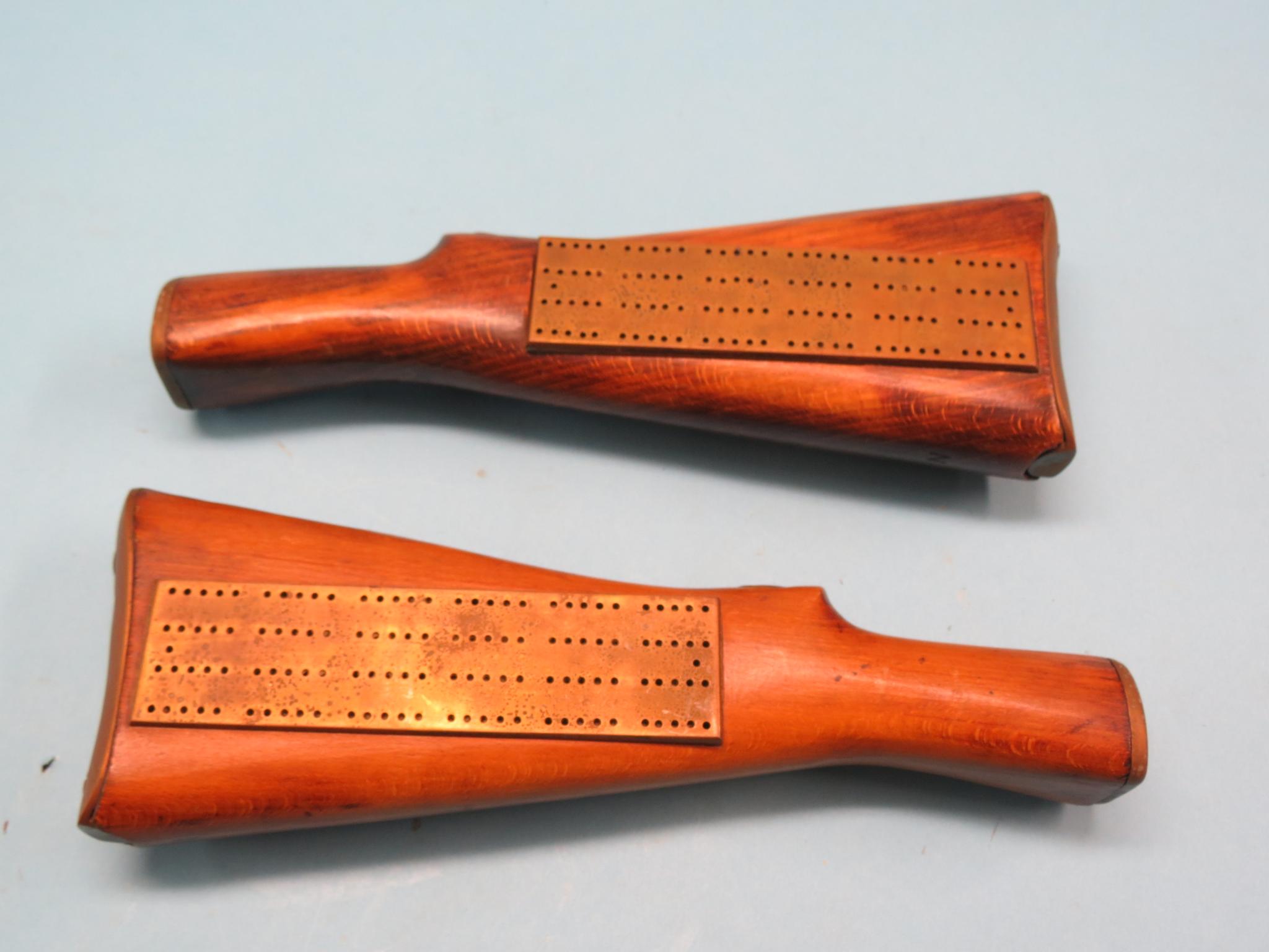 Appraisal: Two novelty brass cribbage boards each mounted within beech rifle