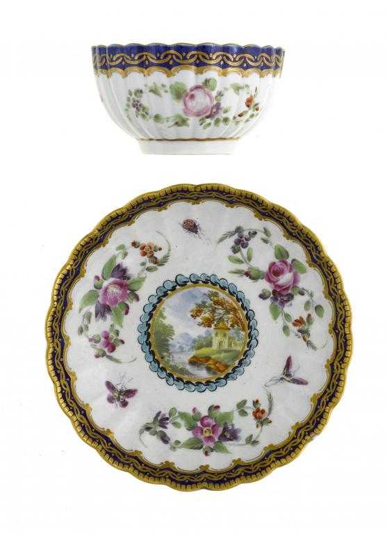 Appraisal: A WORCESTER REEDED TEA BOWL AND SAUCER enamelled with 'Earl