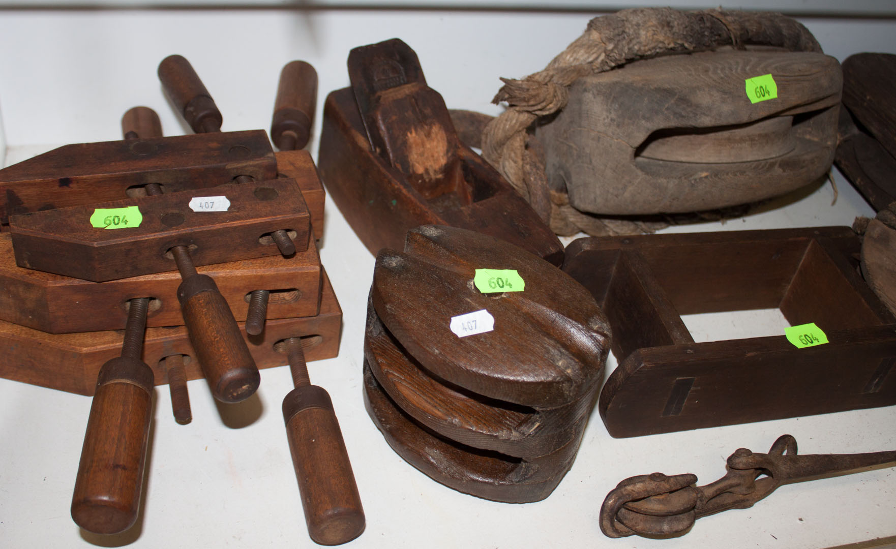 Appraisal: Assortment of antique woodworking tools including saws clamps pulleys and