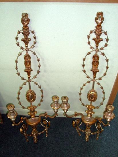 Appraisal: A pair of decorative twin light wall appliqu s with