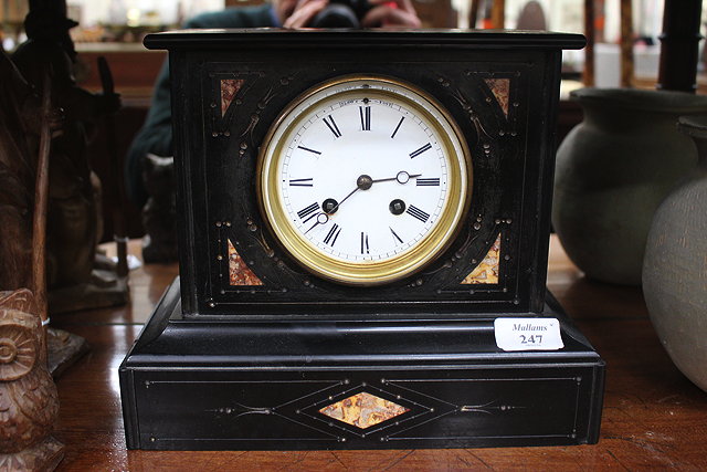 Appraisal: A VICTORIAN BLACK SLATE MANTEL CLOCK the circular white enamel