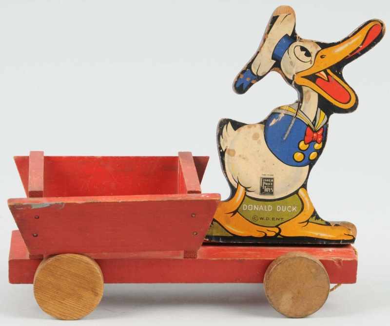 Appraisal: Fisher Price Disney Donald Duck Pulling Cart Toy Description Pre-war