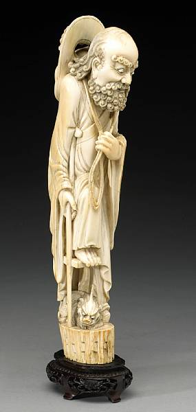 Appraisal: An ivory carving of an immortal with a qilin th