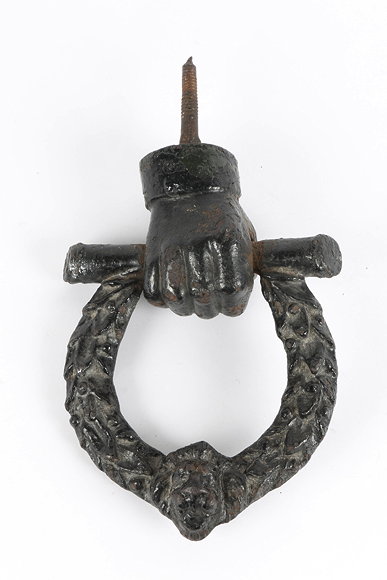 Appraisal: A TH CENTURY CAST IRON DOOR KNOCKER in the form