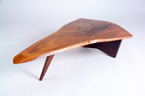 Appraisal: GEORGE NAKASHIMA Fine and early walnut Slab coffee table with